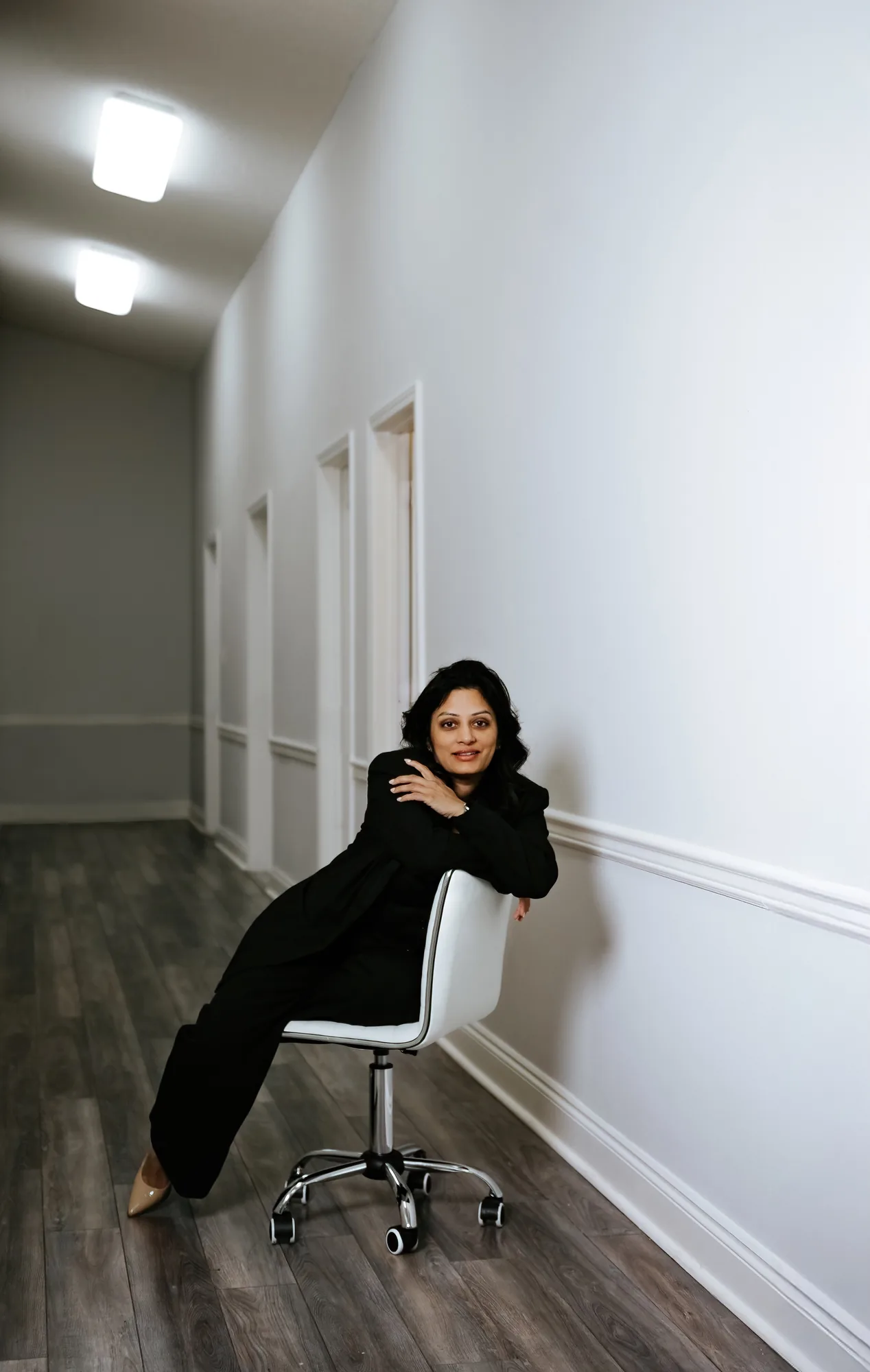 Dr. V in clinic hallway