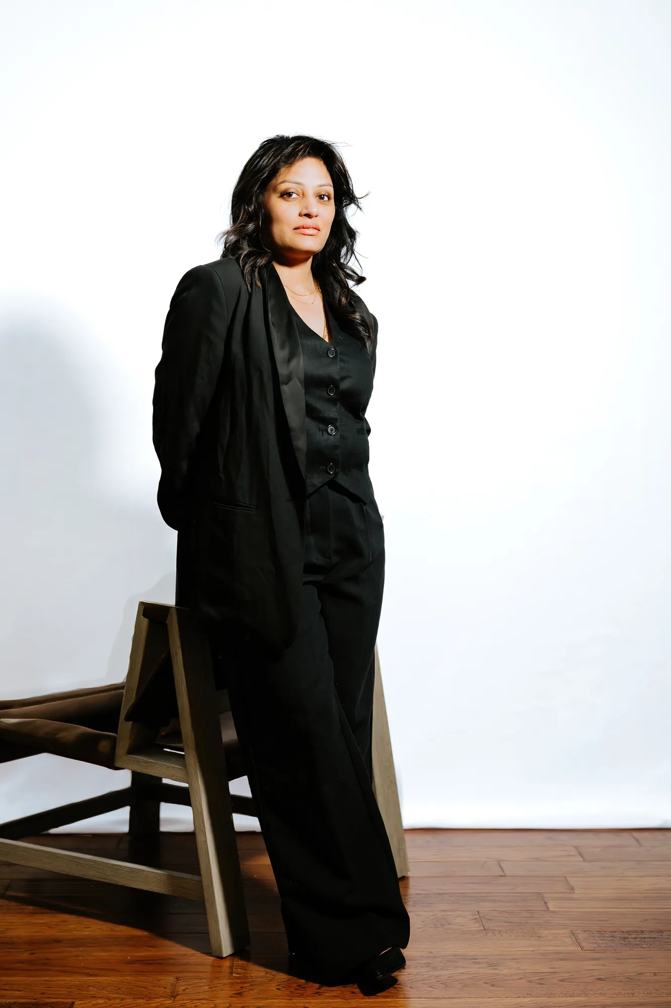Dr. V in contemplative portrait, studio setting